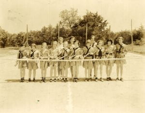 Girl Scouts playing tennis, undated