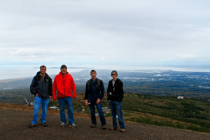 Matt Hornback, Rob Harris, Casey Brokaw and Ben Phrampus overlooking Cook Inlet in Anchorage, Alaska