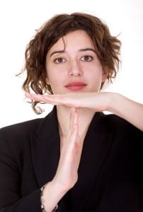 business woman doing the time out sign with her arms