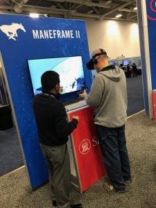 A conventioneer checks out new virtual reality innovations at the SMU SC18 booth.
