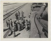 [U.S. Soldiers Giving out Candy, North African Railway Station], ca.. 1942-1943, DeGolyer Library, SMU.