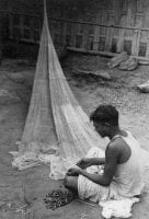[Indian Man Repairing Fishing Net], 1945, DeGolyer Library, SMU.