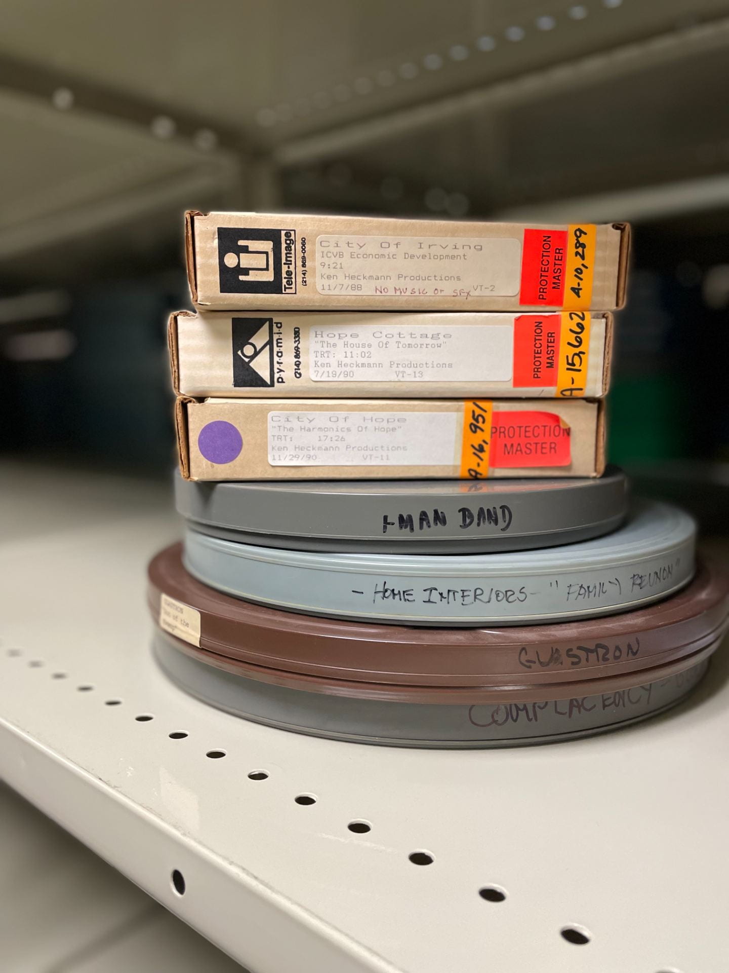 Three tapes and four film cans in the Ken Heckmann collection