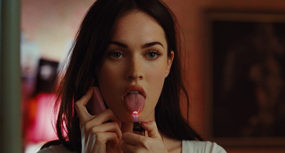 Still from Jennifer's Body showing main character with lighter and phone