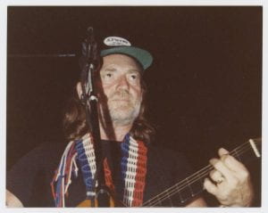Willie Nelson wearing a JCPenney cap